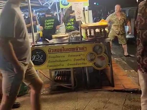 British tourist in Thailand has water thrown over him to extinguish his cigarette